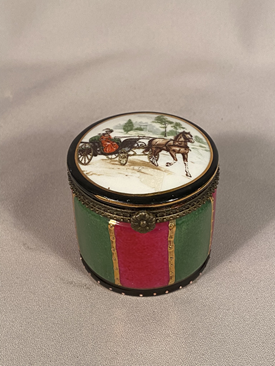 Regal porcelain trinket box the top has a horse and carriage driven by a lady